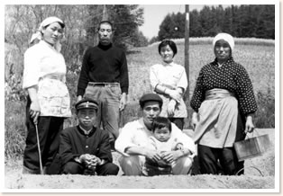 The family members of Tomita, with the 'Traditional Lavender Fields' behind them.